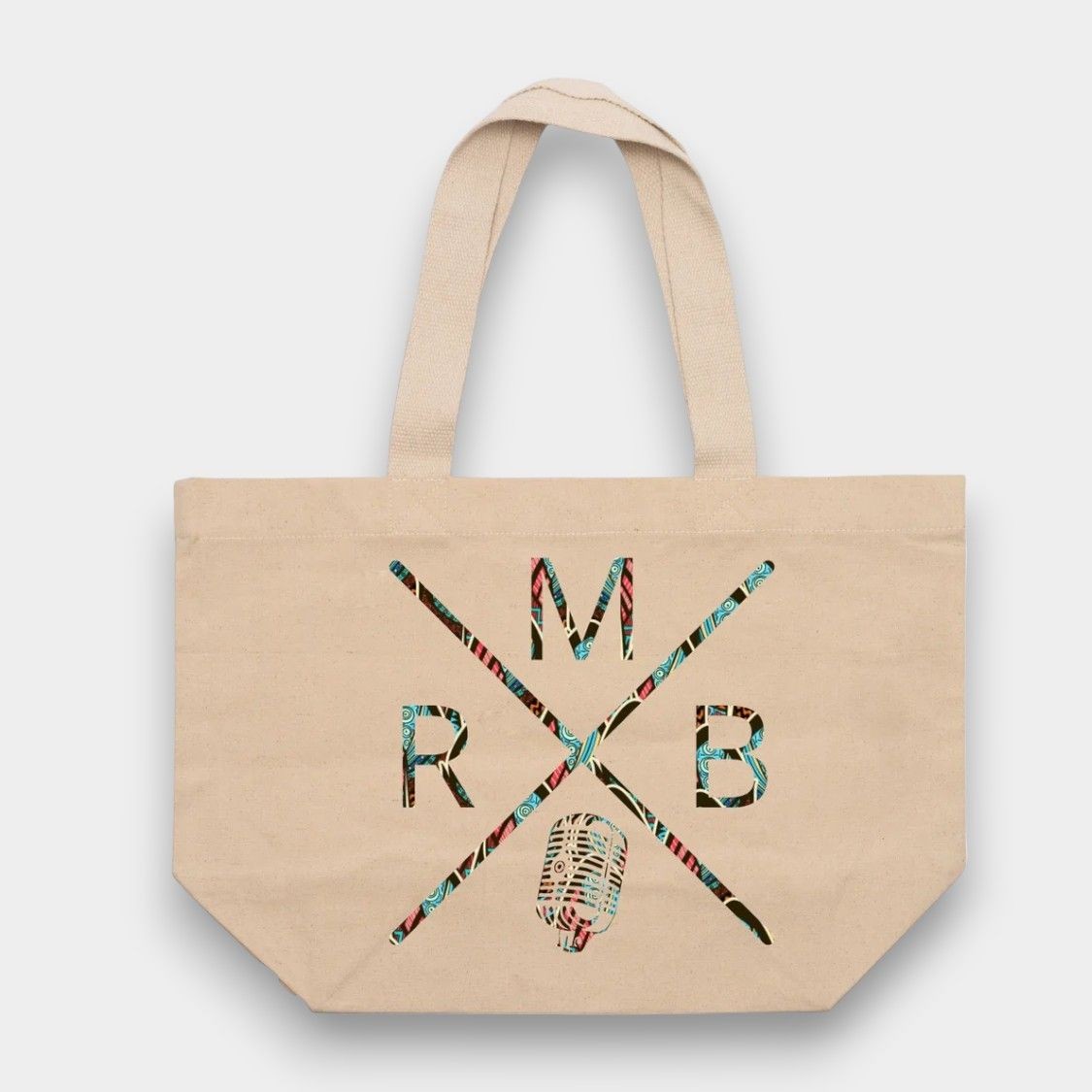 Canvas tote bag with colorful geometric design and letters M, R, B in intersecting lines.