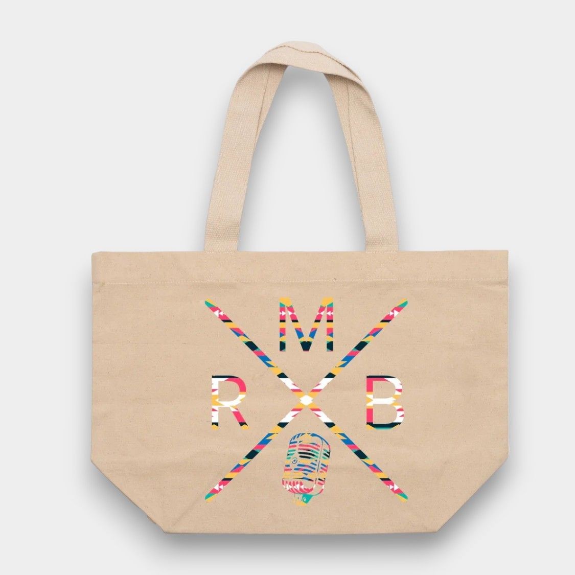 Beige tote bag with colorful geometric letters M, R, B and a microphone design.